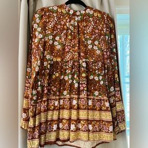 Multi colored blouse with back neck tie.